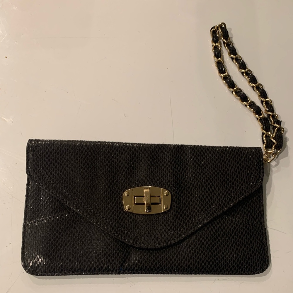 Black small sequince Bebe clutch with gold and black chain link strap